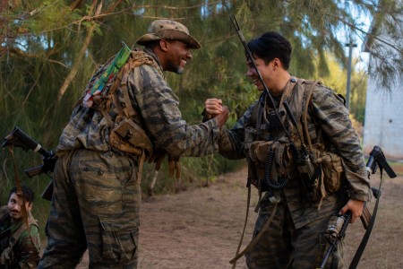 U.S. Army Soldiers with 2nd Infantry Brigade Combat Team, 25th Infantry Division, celebrate a combat engagement victory over blue forces at Kahuku Training Area, Hawaii, Nov. 9, 2023. The Joint Pacific Multinational Readiness Center (JPMRC) is the Army&#39;s newest Combat Training Center (CTC) and generates readiness in the environments and conditions where our forces are most likely to operate in. JPMRC 24-01 includes over 5,300 training participants from across the U.S. Joint Force, New Zealand, the United Kingdom, Indonesia, and Thailand.