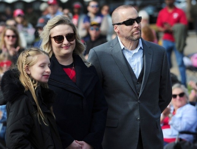 James West, grand marshal of the Veterans Day Parade, stands with his family during Saturday’s event. 