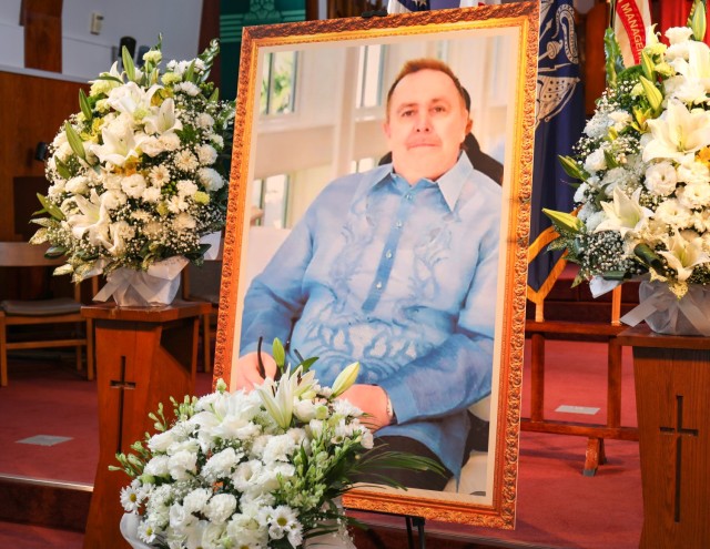 A painting of Kevin McGovern sits on display during a memorial service for him at the Camp Zama Chapel in Japan, Nov. 15, 2023. McGovern, who retired from the Navy, had previously worked as a cook for Child and Youth Services at Camp Zama. 