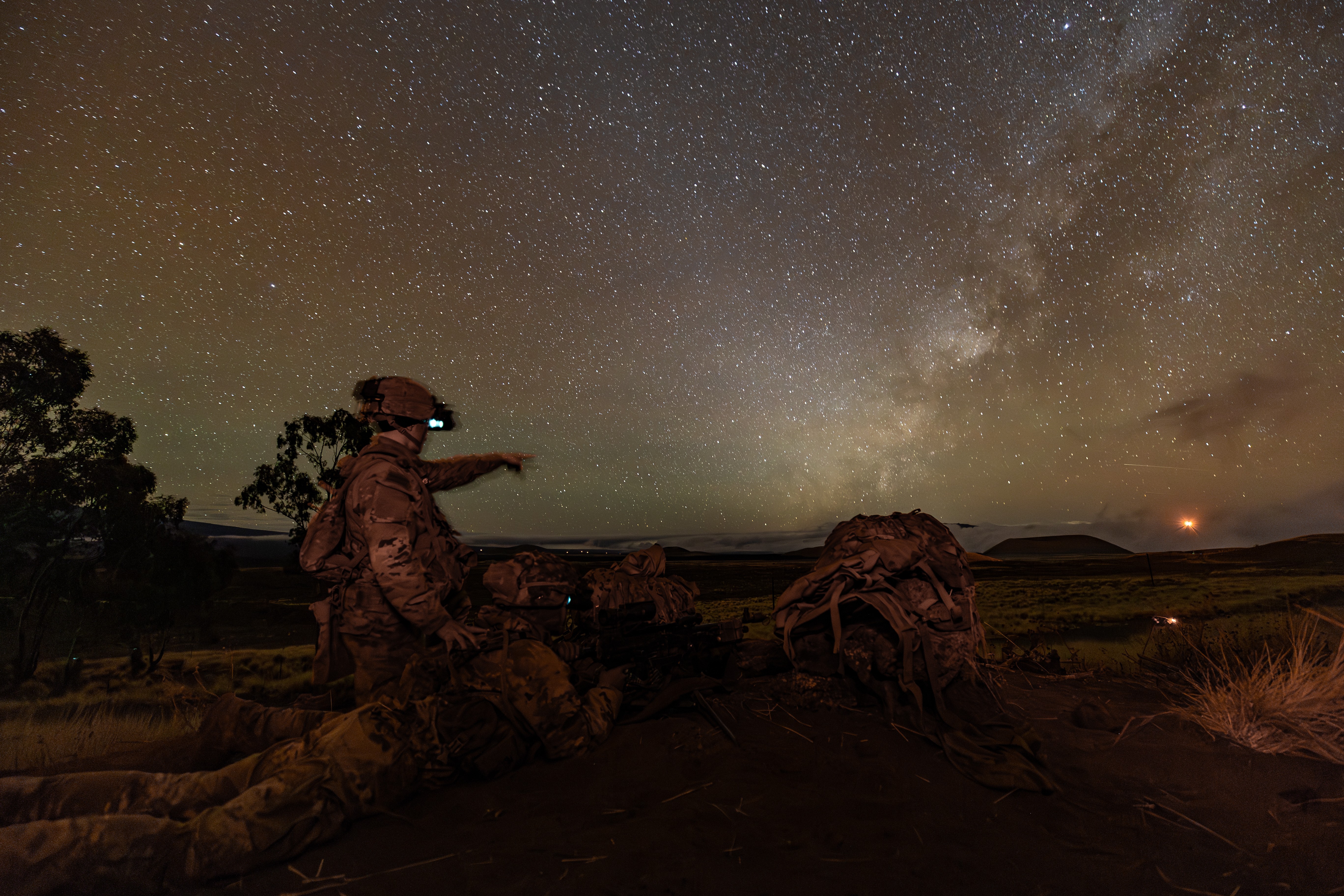 U.S. Army Spc. Collin Hall, assistant gunner, and Spc. Areg Safari, M240 gunner, assigned to Charlie Company, 2nd Battalion, 35th Infantry Regiment, 3rd Infantry Brigade Combat Team, 25th Infantry Division, observe their assigned sector of fire...