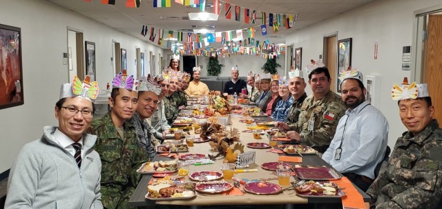 Security assistance liaison officers assigned to the U.S. Army Security Assistance Command enjoy a homemade feast to experience the uniquely America&#39;s Thanksgiving tradition Nov. 16, 2023, at New Cumberland Pennsylvania. 