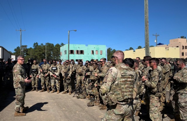 U.S. Army Gen. James E. Rainey, Army Futures Command commanding general, speaks to Soldiers of the Maneuver Center of Excellence Experimental Company, 1st Battalion, 29 Infantry Regiment, 316th Cavalry Brigade and attendees of the Human Machine Integration Summit II following a combined demonstration of Soldier and robotic capabilities, Oct. 17, 2023, at Fort Moore, Ga. To further plan leveraging advanced machines to offload tactical risk to Soldiers, minimize cognitive load, and integrate robots into Army formations, Army Futures Command and MCoE hosted the second HMI Summit, Oct. 17-19. 