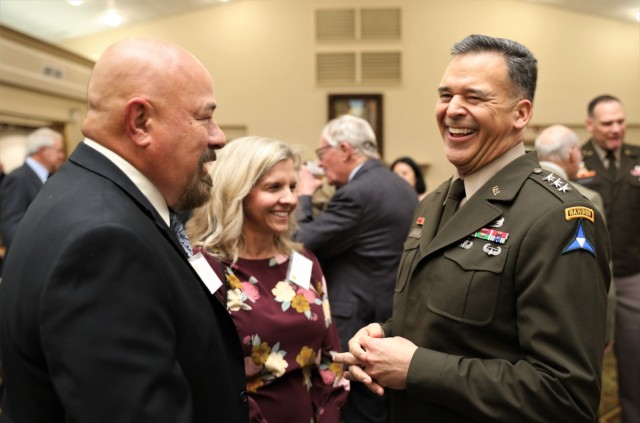 Lt. Gen. Sean C. Bernabe, commander of III Armored Corps and Fort Cavazos, shares a smile and a laugh with Good Neighbor Zack Owen, Waco 100 radio host, at the 2023 Fort Cavazos Good Neighbor Induction Dinner Nov. 9, 2023, at the Lone Star Conference Center. (U.S. Army photo by Erick Rodriguez, Fort Cavazos Public Affairs)