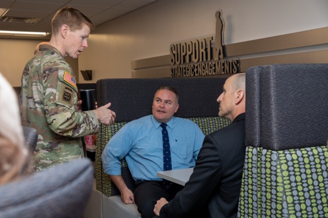 The U.S. Army Security Assistance Command&#39;s commanding general, Brig. Gen. Brad Nicholson (left), connects with staff members at the command&#39;s New Cumberland Pennsylvania headquarters during a Donuts with the CG session.