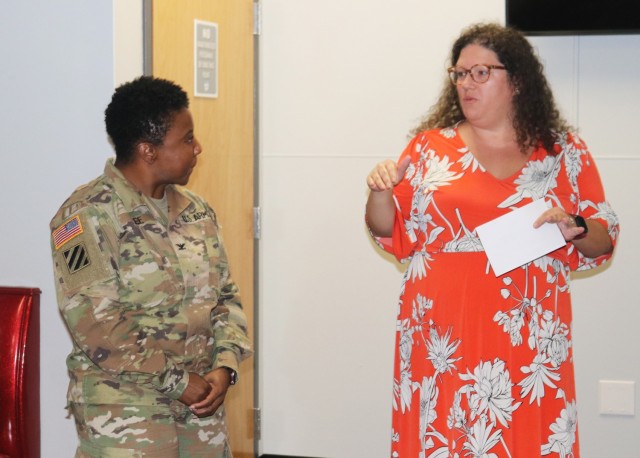 Col. Latrina Lee, military deputy of the CECOM Integrated Logistics Support Center, is welcomed to the CECOM team by Nicole Osaghae, the executive director of CECOM ILSC