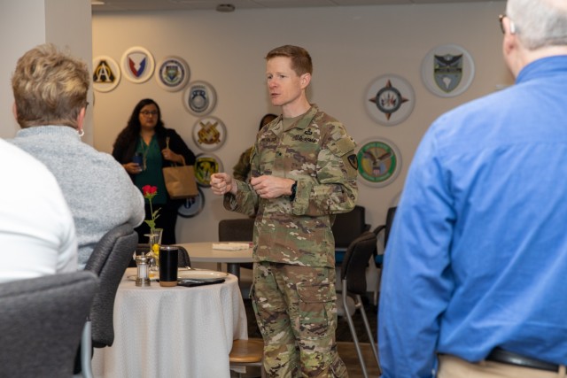 The U.S. Army Security Assistance Command&#39;s commanding general, Brig. Gen. Brad Nicholson (center), connects with staff members at the command&#39;s New Cumberland Pennsylvania headquarters during a Donuts with the CG session.