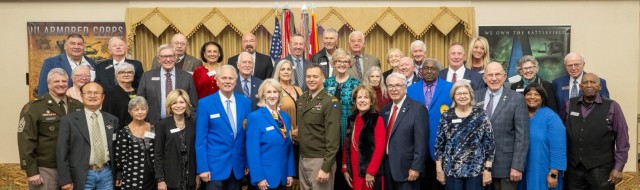 The entire group of Good Neighbors and their spouses pose for a photo with Lt. Gen. Sean C. Bernabe and Command Sgt. Maj. John McDwyer, the III Armored Corps and Fort Cavazos command team, during the Good Neighbors induction dinner Nov. 9, 2023, at the Lone Star Conference Center. (U.S. Army photo by Scott Darling, Fort Cavazos Public Affairs)