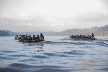 U.S. and Brazilian Army Soldiers move south along the Oyapock River during Exercise Southern Vanguard 24 in Oiapoque, Brazil, on Nov. 12, 2023. Southern Vanguard is an annual exercise at the operational and tactical levels to increase interoperability between U.S and Western Hemisphere forces, in this instance, Brazil.