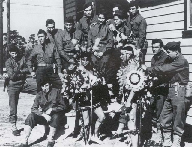 Comanche code-talkers of the 4th Signal Company pose for a photo. Native American code talkers served in World War I and World War II. 