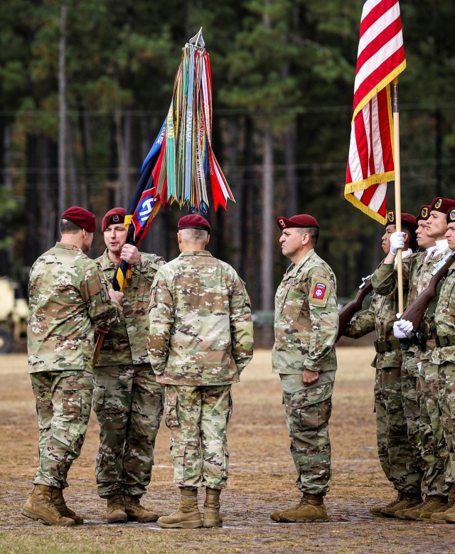 U.S. Army Lt. Gen. Christopher Donohue passes the division colors to  Brig. Gen. James “Pat” Work, Commanding General of the 82nd Airborne Division during the change of command ceremony on Nov. 17, 2023, at Fort Liberty, North Carolina. The ceremony symbolizes a transfer of authority as Maj. Gen. Christopher LaNeve relinquished command to Brig. Gen. Work.