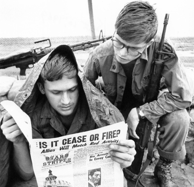 U.S. troops read Stars and Stripes newspaper in Cu Chi, South Vietnam in 1969. 