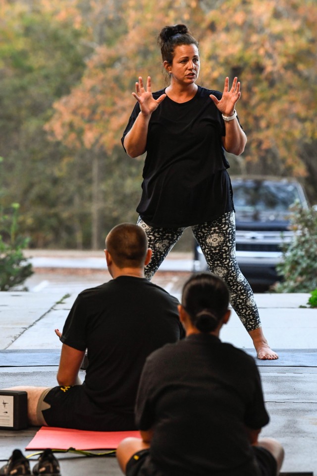 Danielle Hanson, a 500-hour registered volunteer yoga teacher, conducts a yoga class with Company E. 120th Adjutant General Battalion and the Fitness Training Company, Nov. 8.