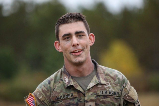 Spc. Elihu Wagner relaxes after a 12-mile ruck march