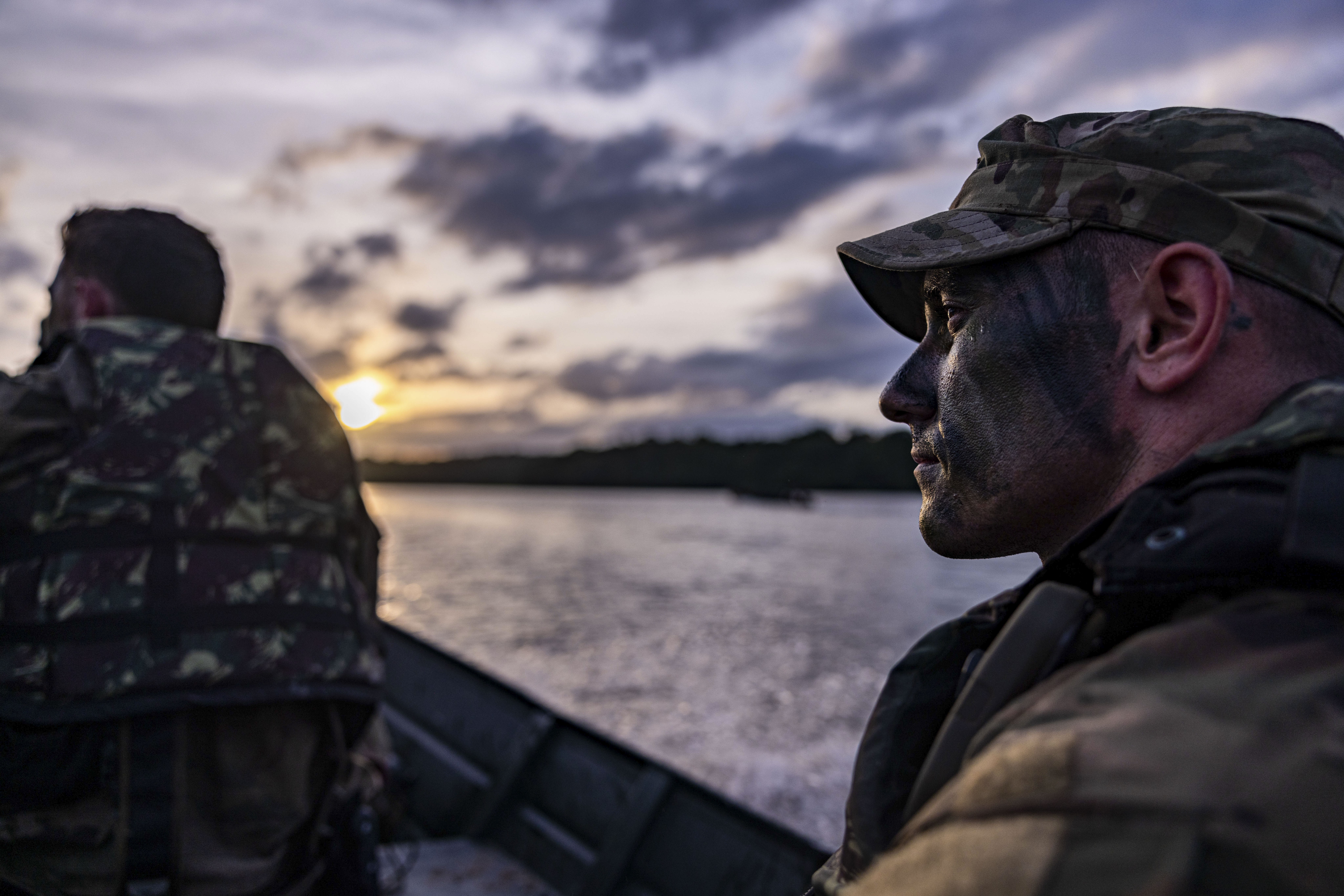 U.S. Army Soldier, Staff Sgt. Justin Reeb, squad leader assigned to 1st Battalion, 26th Infantry Regiment, 2nd Brigade Combat Team, 101st Airborne Division (Air Assault), transports in a boat after a platoon-level jungle mock-reconnaissance on an...