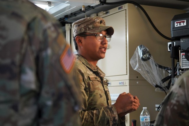 Spc. May guides Lalor through some of the 1st Inf. Div. facilities.