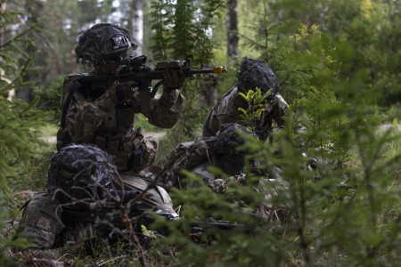 Soldiers assigned to 1st Battalion, 506th Infantry Regiment ‘Red Currahee,’ 1st Brigade Combat Team, 101st Airborne Division, supporting the 4th Infantry Division, return fire during a platoon situational training exercise at Nurispalu Training Area, Estonia, July 25, 2023. The training enabled soldiers to engage in simulated combat scenarios, refine their tactical skills in real-world conditions, and enhance their adaptability to handle challenges on the battlefield.