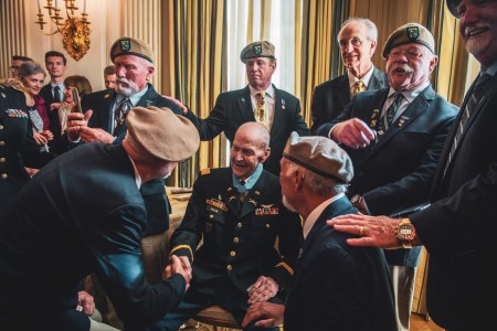 U.S. Army Capt. Larry L. Taylor is greeted by former teammates after receiving the Medal of Honor at the White House in Washington, D.C., Sept. 5, 2023. Taylor was awarded the Medal of Honor for his acts of gallantry and intrepidity above and beyond the call of duty while serving as 1st Lt. Taylor, a team leader assigned to Troop D (Air), 1st Squadron, 4th Cavalry, 1st Infantry Division, near the hamlet of Ap Go Cong, Republic of Vietnam, June 18, 1968. 