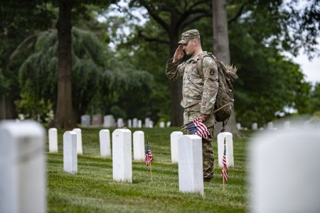 Soldiers from the 3d U.S. Infantry Regiment (The Old Guard) place U.S. flags at gravesites in Section 25 of Arlington National Cemetery, Arlington, Va., May 25, 2023. This was the 75th anniversary of Flags In where over 1,000 service members placed more than 260,000 flags at gravesites at Arlington National Cemetery and the U.S. Soldiers’ and Airmen’s Home National Cemetery.