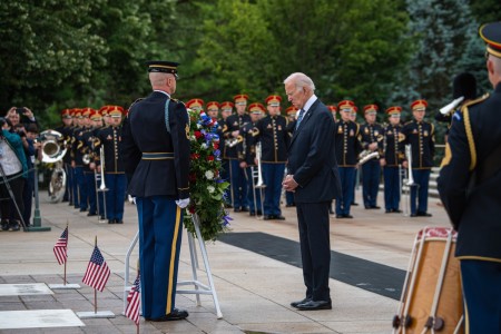 President of the United States Joseph R. Biden pauses for a moment of reverence while participating in a wreath-laying ceremony in honor of Memorial Day at Arlington National Cemetery in Arlington, Virginia, May 29, 2023.