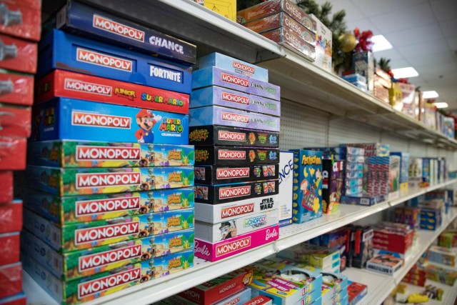 Board games line one of the many toy-filled shelves Nov. 16 at Santa&#39;s Workshop at The Great Place during their ribbon cutting ceremony. (U.S. Army photo by Blair Dupre, Fort Cavazos Public Affairs)