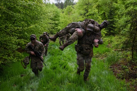 A U.S. Soldier assigned to 1st Squadron, 2nd Cavalry Regiment carries a simulated casualty to a cover position during the unit spur ride in the vicinity of Schnaittenbach, near Grafenwoehr Training Area, Germany, May 10, 2023. The spur ride...