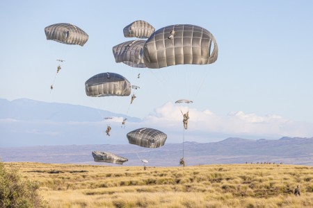 U.S. Army Soldiers assigned to 2nd Infantry Brigade Combat Team (Airborne), 11th Airborne Division, jump from the C-17 at Pohakuloa Training Area, Hawaii, Oct. 31, 2023. The Joint Pacific Multinational Readiness Center (JPMRC) is the Army’s newest Combat Training Center (CTC) and generates readiness in the environments and conditions where our forces are most likely to operate in. JPMRC 24-01 includes over 5,300 training participants from across the U.S. Joint Force, New Zealand, the United Kingdom, Indonesia, and Thailand. 