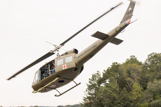 A Friends of Army Aviation Huey takes off for a grad ride in Ozark, Ala. on Nov. 30, 2023.