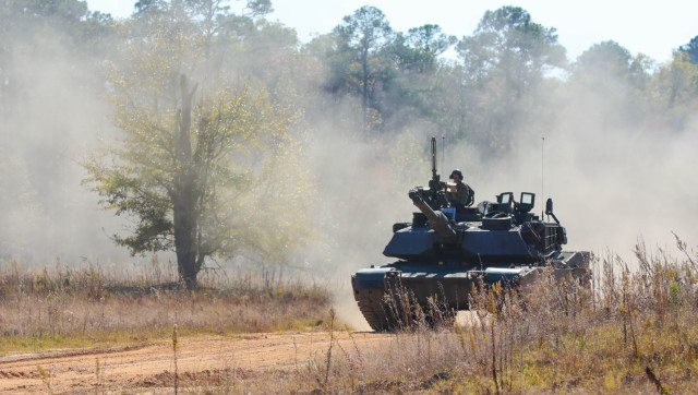 An M1A2 Abrams tank assigned to 1st Battalion, 64th Armor Regiment, 3rd Infantry Division travels down a tank trail during a Situational Training Exercise lane at Fort Stewart, Georgia, Nov. 8, 2023. STX training lanes give tank crews the opportunity to test their proficiency in simulated combat with other tanks. (U.S. Army photo by Pfc. Benjamin Hale)