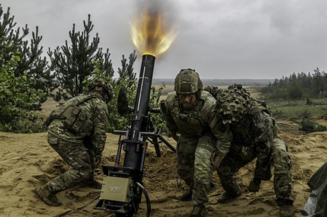 Army mortarmen assigned to the 1st Battalion, 506th Infantry Regiment ‘Red Currahee,’ 1st Infantry Brigade Combat Team, 101st Airborne Division, supporting the 4th Infantry Division, fire an M120A1 120 mm towed mortar system du...
