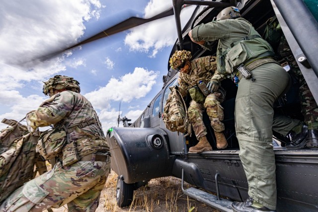 U.S. Army Soldiers assigned to 1st Battalion, 26th Infantry Regiment, 2nd Brigade Combat Team, 101st Airborne Division (Air Assault) get off a Brazilian Army helicopter for an air assault operation in Amapá, Brazil. during Exercise Southern Vanguard 24, Nov. 8, 2023. Southern Vanguard, an annual bilateral exercise which rotates between partner nations in the U.S. Southern Command area of responsibility, is designed to enhance partner interoperability between the U.S. and partner nation forces. (U.S. Army photo by Spc. Joshua Taeckens)