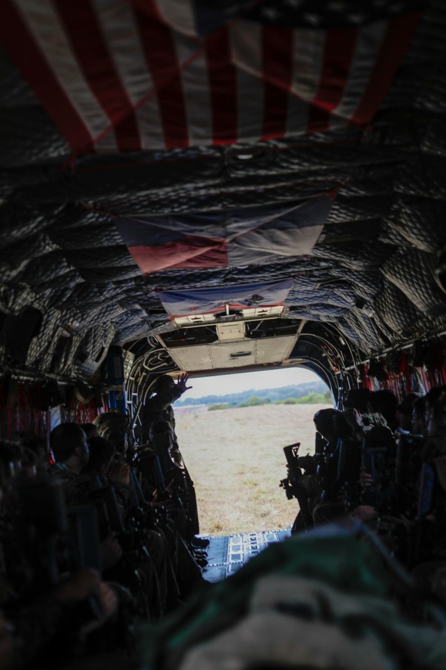 A U.S. Army Soldier, assigned to 2nd Battalion, 27th Infantry Regiment, 3rd Infantry Brigade Combat Team, 25th Infantry Division, gives Soldiers of the New Zealand Army a class on U.S. operations when entering and exiting a CH-47 Chinook during a joint training session for the Joint Pacific Multinational Readiness Center (JPMRC) at Helemano Military Reservation, Hawaii, Nov. 7, 2023. JPMRC is the Army’s newest Combat Training Center (CTC) and generates readiness in the environments and conditions where U.S. forces are most likely to operate. JPMRC 24-01 includes over 5,300 training participants from across the U.S. Joint Force, New Zealand, the United Kingdom, Indonesia, the Philippines and Thailand.