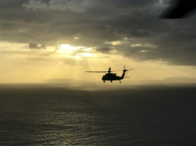 Chief Warrant Officer Rick Dean and others fly UH-60 Black Hawk helicopters across the Mediterranean Sea during a mission. Dean, now assigned to U.S. Army Aviation Battalion–Japan, recently marked the end of his 26-year career with a final flight at Camp Zama’s Kastner Airfield in Japan.