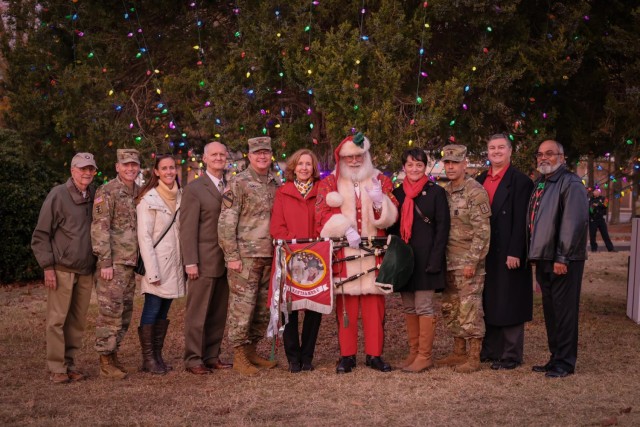 Fort Gregg-Adams leaders and officials from the surrounding communities pose Thursday, Nov. 30, 2023 at the Fort Gregg-Adams Grand Illumination.