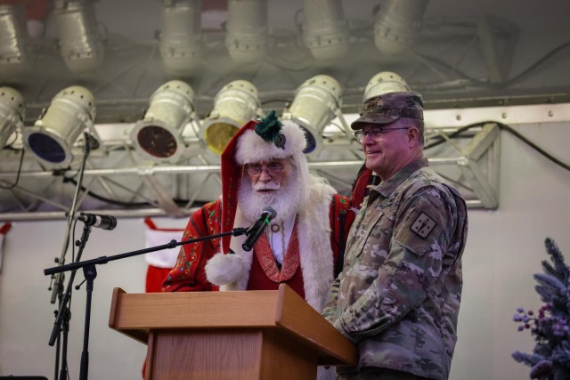Santa speaks to the crowd as Maj. Gen Mark Simerly smiles Thursday, Nov. 30, 2023 at the Fort Gregg-Adams Grand Illumination.
