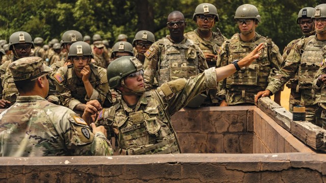 A trainee learns to throw a grenade during basic combat training at Fort Jackson, South Carolina.