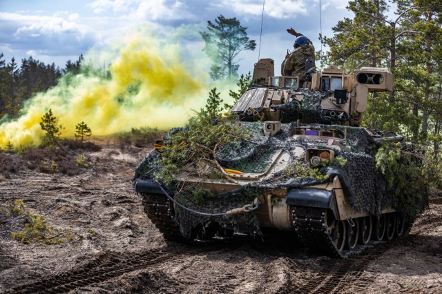 U.S. Soldiers assigned to the 2nd Armored Brigade Combat Team, 1st Cavalry Division supporting the 4th Infantry Division maneuver an M2 Bradley Fighting Vehicle during exercise Arrow 23 in Niinisalo, Finland, May 5, 2023. Exerc...