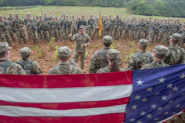 Lieutenant Colonel Chad A. Monroe, Clemson University professor of military leadership, conducts a contracting ceremony for Clemson Army ROTC cadets in a light rain before a field exercise at a muddy training area near the Clemson Experimental Forest, Sept. 16, 2021. (Photo by Ken Scar)