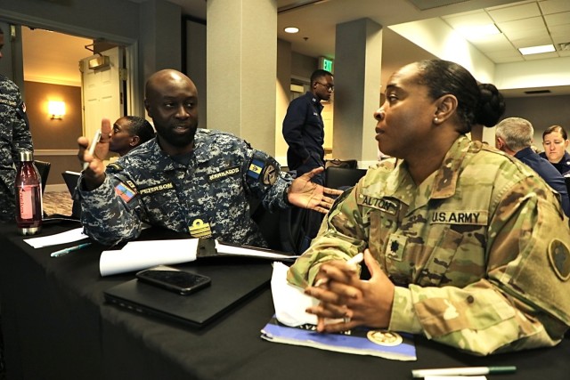 Commander Mark Peterson, Barbados Defense Force lead planner dialogues with Lt. Col. Cathy Alston, Army South Lead Gender Focal Point