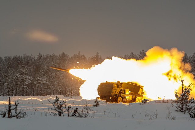 An M142 High-Mobility Artillery Rocket System from 3rd Battalion, 27th Field Artillery Regiment, 18th Field Artillery Brigade, 18th Airborne Corps, fires a rocket during a HIMARS rapid infiltration exercise at Camp Adazi, Latvia, Dec. 2, 2023. ...