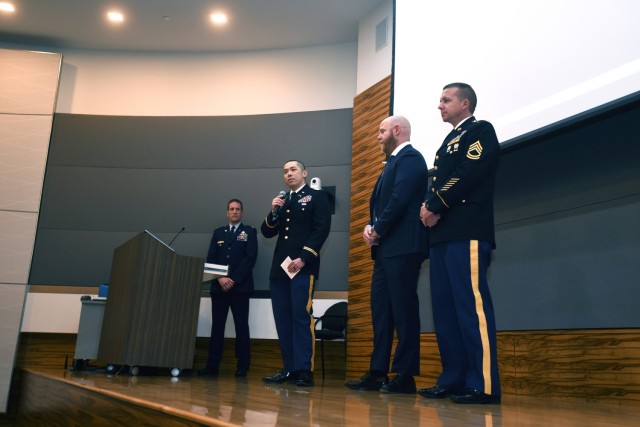 Army Lt. Col. Loong Lee, center left, state training officer with the Arizona National Guard’s Joint Force Headquarters, makes a pitch to panel judges at the 2023 National Guard Bureau Innovation Challenge at the Herbert R. Temple Jr. Army...