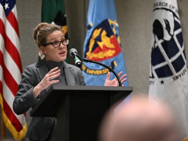 Acting Chancellor, Denise Marsh, National Defense University College of International Security Affairs, addresses senior leaders, academic, and guests during the Irregular Warfare Forum in Arlington, Virginia, Dec. 5-7.