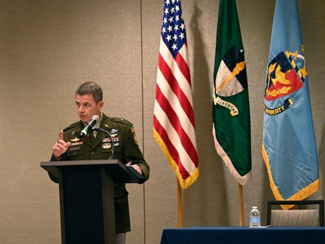 Brig. Gen. Guillaume “Will” Beaurpere, U.S. Army John F. Kennedy Special Warfare Center and School commanding general, provides opening remarks during the Irregular Warfare Forum in Arlington, Virginia, Dec. 5-7.