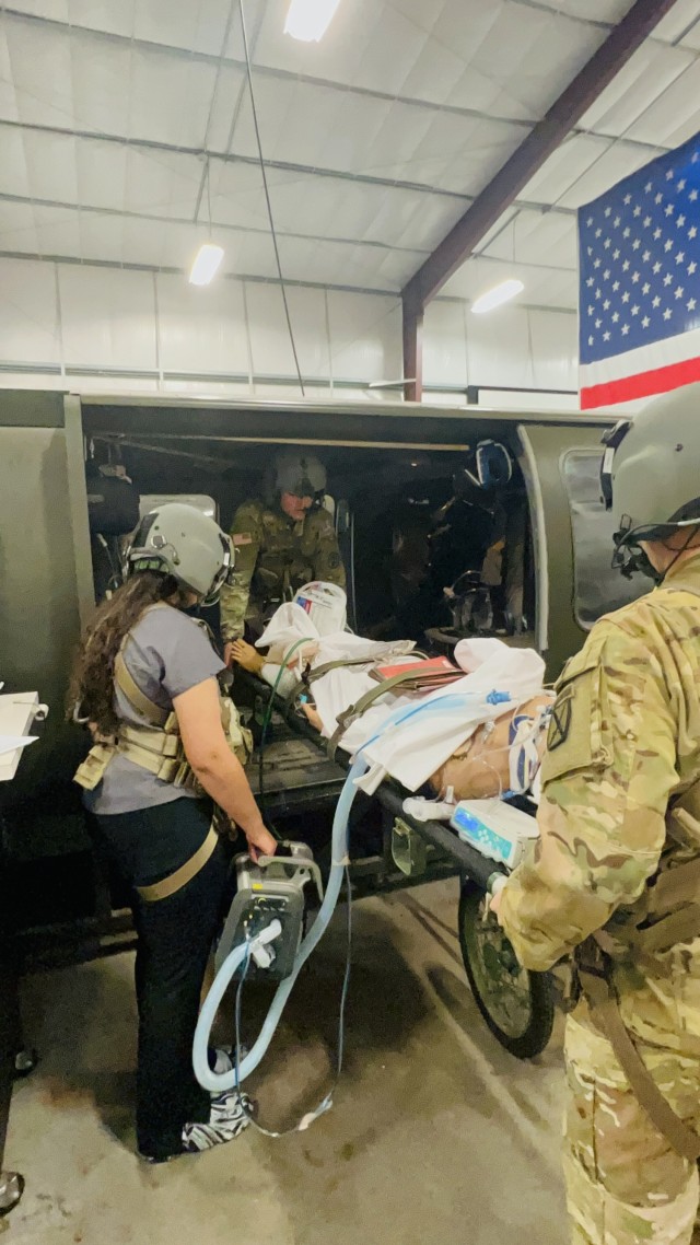 During a critical part of the training the students were tasked with moving and loading their patient onto the aircraft for transport at the DTC on Fort Novosel. Once the patient is loaded the door to the simulator is closed and the simulation...