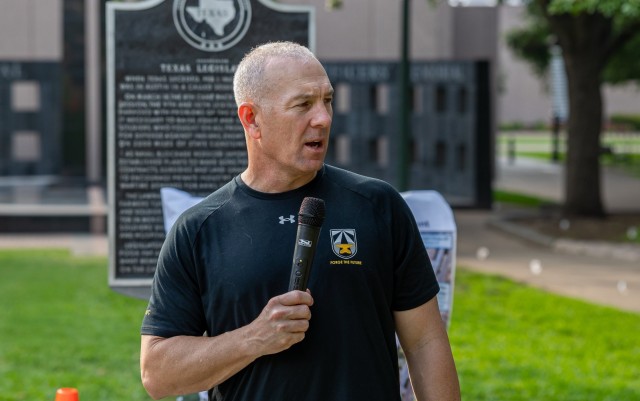 Command Sgt. Maj. Brian A. Hester speaks to participants of the Army Futures Command Army Birthday Fitness Event in front of the Texas State Capitol Building in Austin, Texas, June 14, 2023.