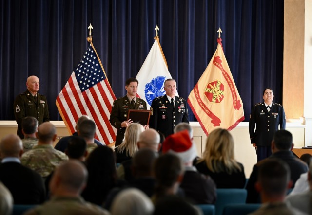 On the occasion of his retirement, CSM Traylor prepares to receive his retirement certificate from Col. Kline, officially marking the end of his 31-year career as an active-duty soldier during a retirement ceremony at the Weckerling Center, Presidio of Monterey, Calif., Dec. 12.