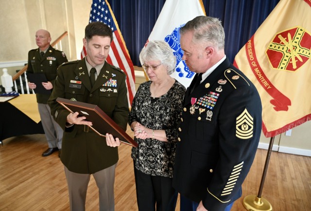 Col. Kline, left, presents Mrs. Daylinda Pace, with a certificate of appreciation in recognition of her unselfish, faithful and devoted support as a mother whose three sons all served in the U.S. Army.
