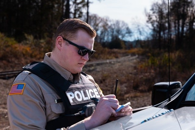 Tristan Borostowski, a new conservation law enforcement officer at Redstone, checks the placard on the dash of a hunter’s vehicle. He served in the Army from 2017 to this year, and was a conservation officer at Fort Drum, N.Y., for five years. 