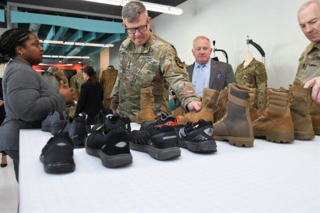 GEN James E. Rainey, commanding general of U.S. Army Futures Command (AFC), is briefed on the latest footwear prototypes by footwear research engineer Anita Perkins during a visit to DEVCOM Soldier Center in Natick, Massachusetts on Nov 7, 2023.