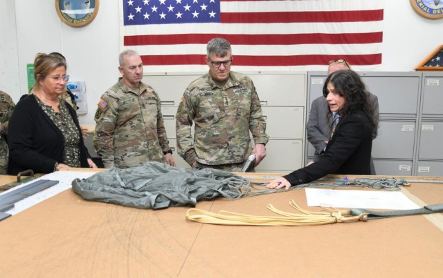 GEN James E. Rainey, commanding general of U.S. Army Futures Command (AFC), is briefed on cargo parachute textile materials by Jennifer Hunt, team leader of the Prototype Textile and Aerial Fabrication Team (PTAFT) during a visit to DEVCOM Soldier Center in Natick, Massachusetts on Nov 7, 2023.
