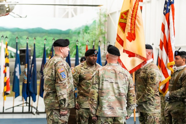 Garrison Command Sgt. Maj. Gary J. Williams assumes responsibility from former Command Sgt. Maj. Christopher T. Doss during the ceremony on Dec. 12 inside the Army Aviation Museum.